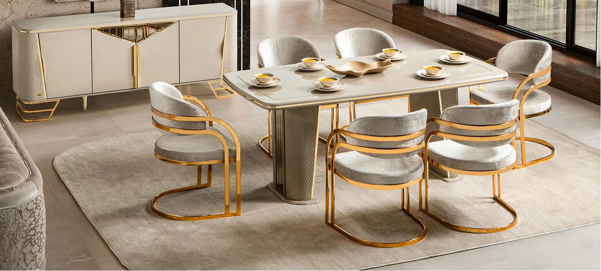 Modern dining room with a table, chairs, and decorative elements.
